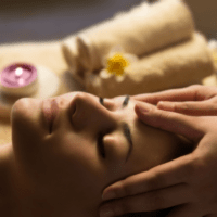 Woman receives Head and Shoulder Massage