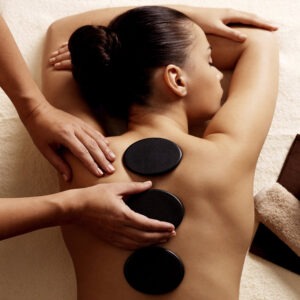 Young Woman receives a Hot Stone Massage